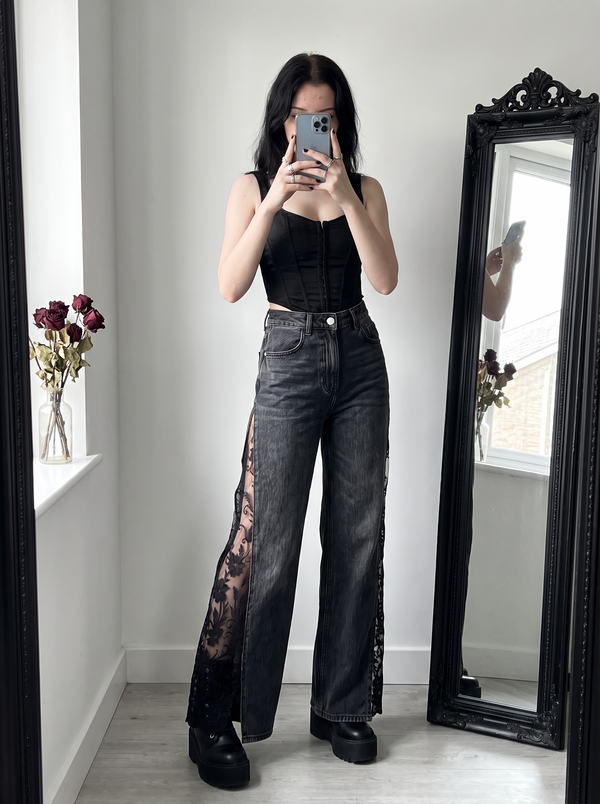 Raven Lace Jeans in black styled with a corset top and platform boots, mirror selfie